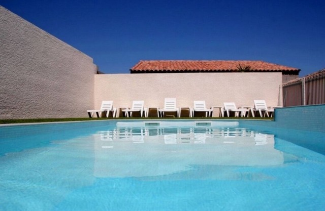 Modern, air-conditioned house with large private terrace and shared swimming pool