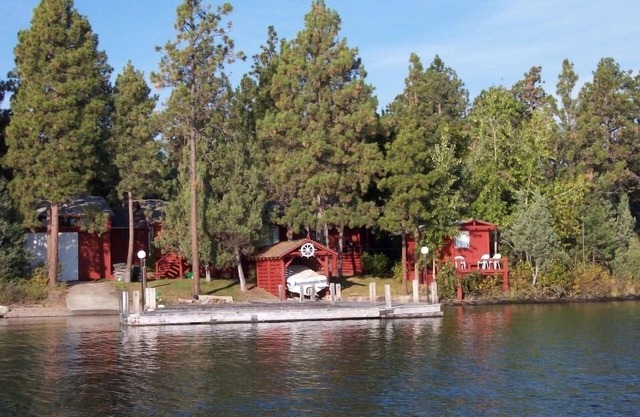 Moose Lodge Rustic Log Home Includes Two Boat Slip Dock with 2 guest cabins