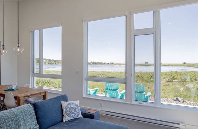 NEW! Modern light-filled cottage. Water views. Walking distance to Hirtle Beach.