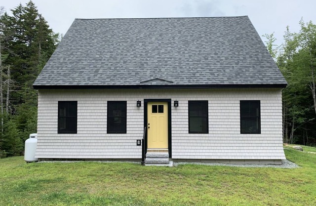 Newly built and fresh vacation home tucked in the woods of Mount Desert.