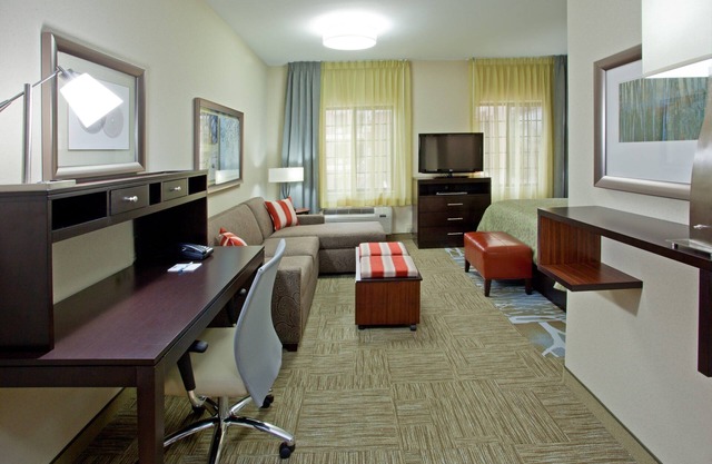 Outdoor Pool + 24 Hour Fitness Center + Free Breakfast