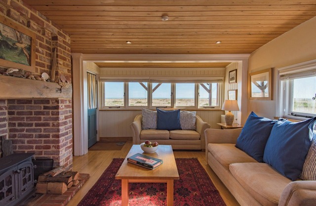 Quirky holiday cottage right on the beach at Dungeness in Kent.