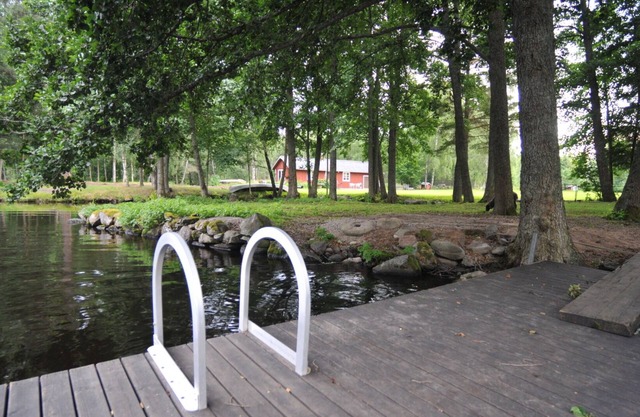 Red and white holiday home beautifully situated by the river Emån