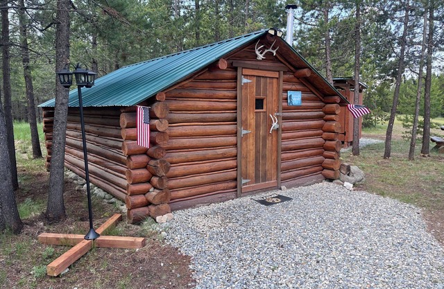 Retreat to our cozy cabin nestled in a private hideaway.nSolar lights & shower