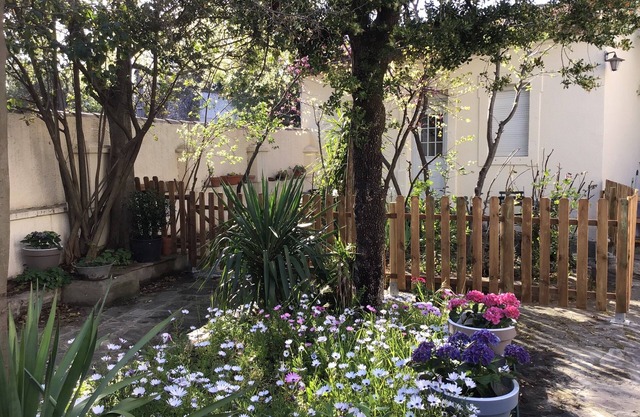 Small flowered house with private garden near town center