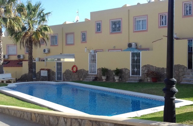 Spacious 2nd-floor apartment with 3 bedrooms, 2 bathrooms, and a solarium.