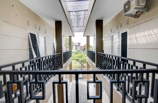 SPOT ON 92797 Awi Stay Syariah Near SIMPANG KAWASAN INDUSTRI WILMAR PELINTUNG