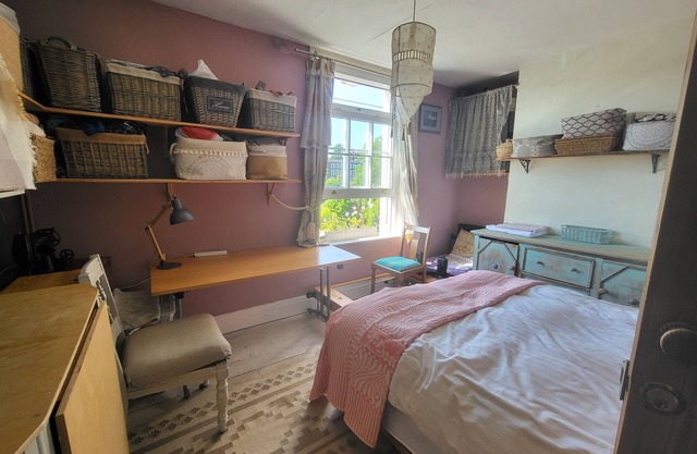 Study or holiday. Close to city, quiet, with trees and river view to the west.