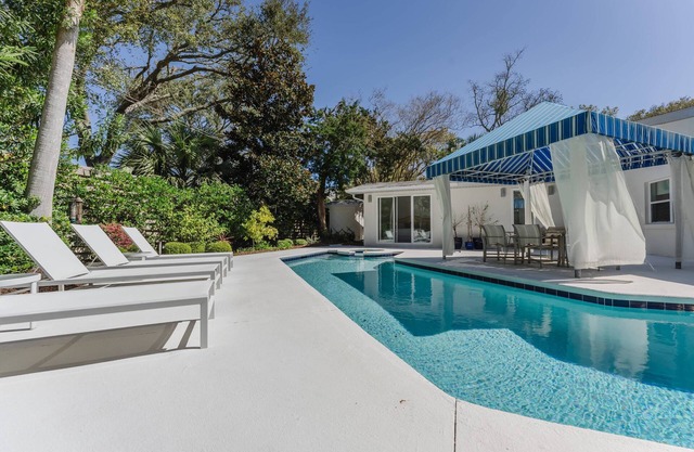 Stunning one-level, 5 bedroom East Beach home with heated pool & spa