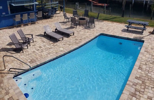 Sunbather – Waterfront Oasis with Heated Pool and Spacious Outdoor Living