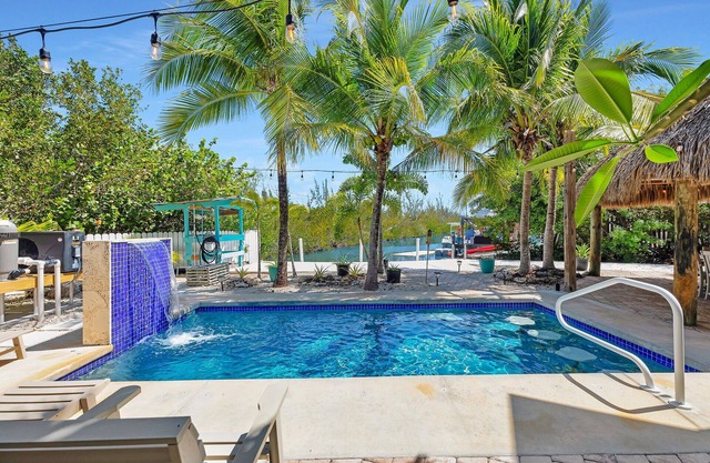 Tropical paradise on canal in Lower Keys-pool, tiki, firepit, dock, dog friendly