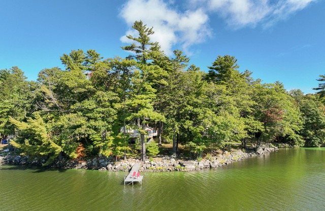 Two-story lakefront home with a seasonal dock, furnished deck, & washer/dryer