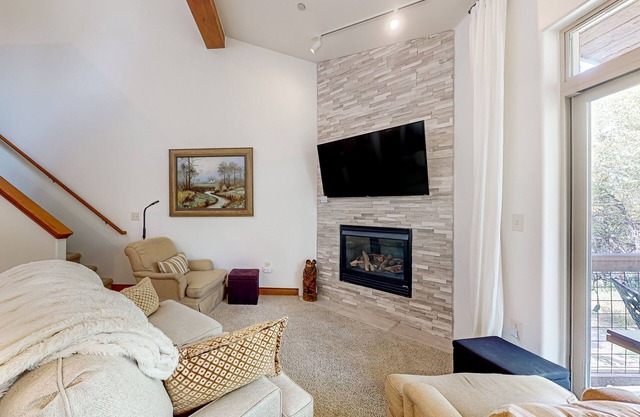 Two-story, riverfront condo with balcony & fireplace - close to everything