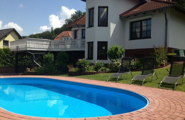 Vacation home for 8 guests with pool, fireplace, playground, large garden