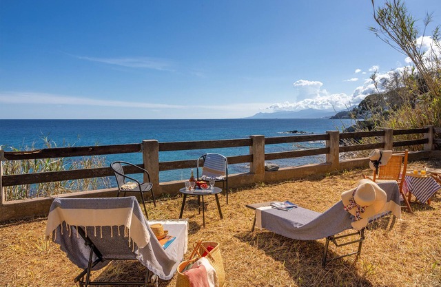 Villa Erbalunga, waterfront home, with garden and sea-view terrace.