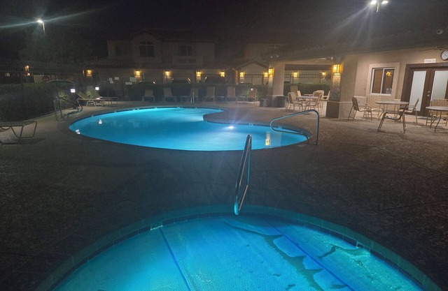 Walk to golf and dining from this first floor Superstition Lakes condo near pool