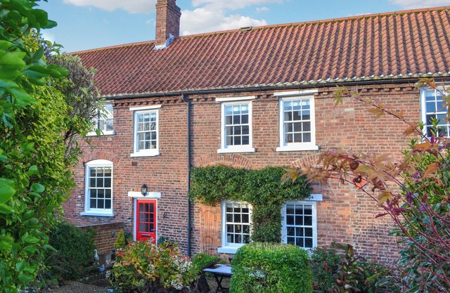 We love the courtyard location of this historic cottage.