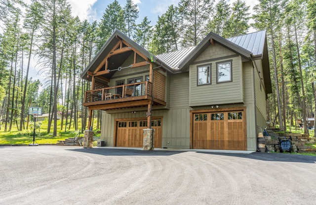 Wilderness retreat with a large deck, grill, updated interior, fireplace, and AC