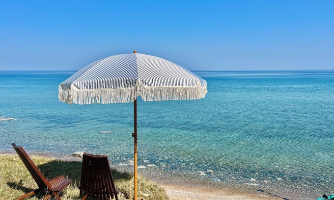 Cheboygan Cottage | 125 ft of Private BEACHFRONT with large, secluded yard & spectacular views!