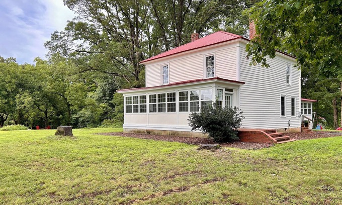 Clarksville House | 1920s farmhouse with a water view, and 6 miles to downtown Clarksville.