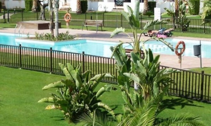 Roldan Apartment | 2 Bedroom (sleeps 4/5) ground-floor apartment backing onto grass area & pool