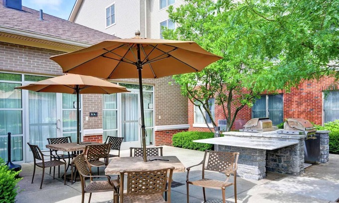 Lexington Hotel | 2 Convenient Suites Near Airport | Free Parking | Seasonal Pool | Kitchen