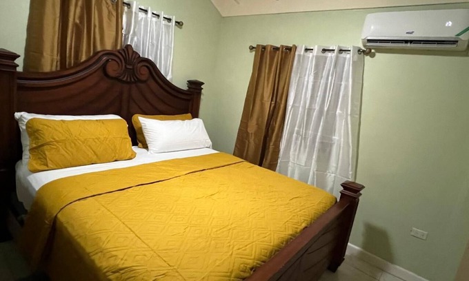 Spring Village House | 25 minutes from Kingston! Cozy Retreat in The Orchards, St. Catherine
