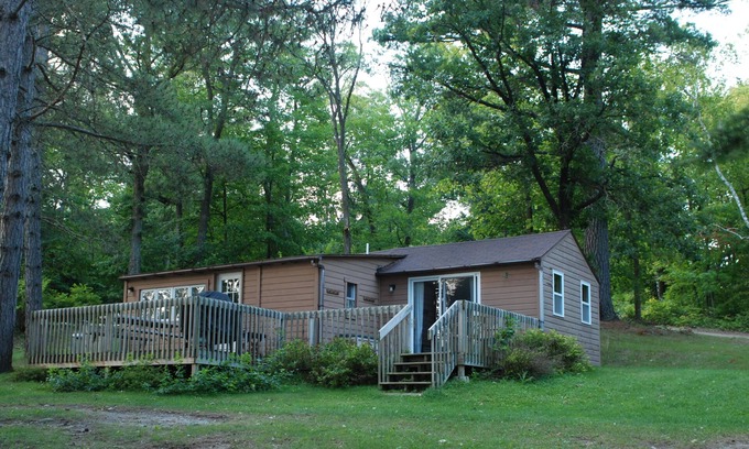 Nevis Cabin | 2BR Cabin Nestled in Towering Pines on a quiet lake. Pets accepted!