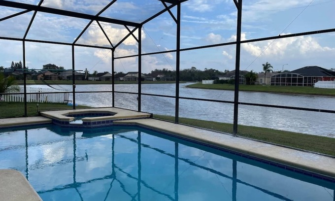 Crescent Lakes House | 6BR Luxury house-South Facing Private Pool, on a lake, hot-tub, BBQ, near Disney