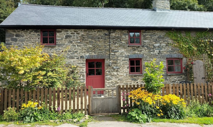 Lampeter Cottage | A cosy former horse stable with stone walls and old beams throughout