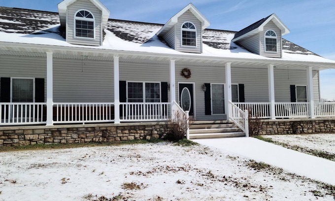 Pomona House | A large country home with scenic views of a working cattle farm & rural locale.