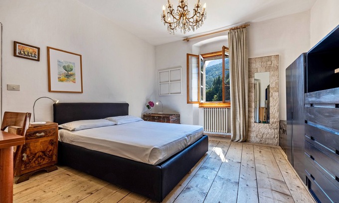 Sella Giudicarie Apartment | Apartment "Casa Nel Borgo Iris" with Mountain View and Shared Garden