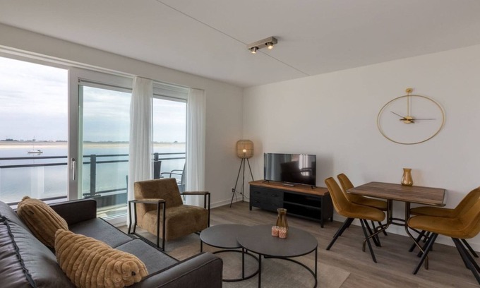 Sint-Annaland Apartment | Apartment in Sint-Annaland with Water Views