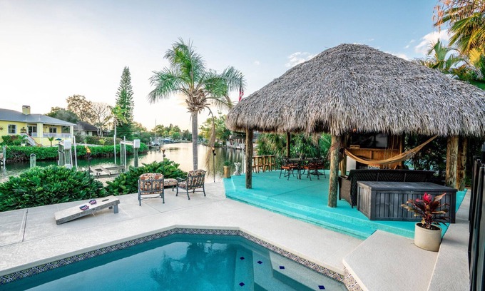 Apollo Beach House | Apollo's Kon-Tiki Hut Resort - Water front-Heated pool