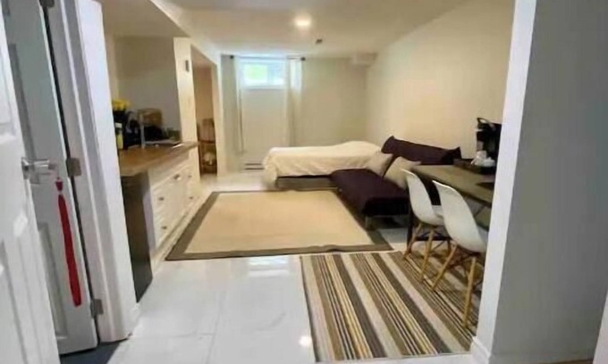 Aylmer House | Basement studio with an attached private bathroom and parking.