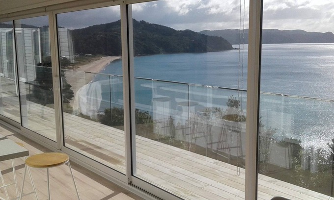 Tairua House | Beach and ocean views in every room.