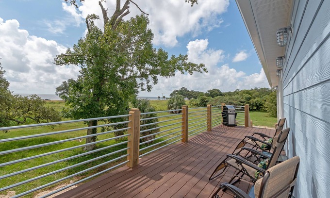 Mississippi City House | Beach house with gorgeous views, private green space, and steps to the beach.