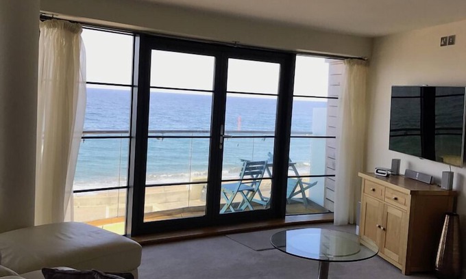 West Bay Apartment | Beachside, stunning apartment with sea and harbour views