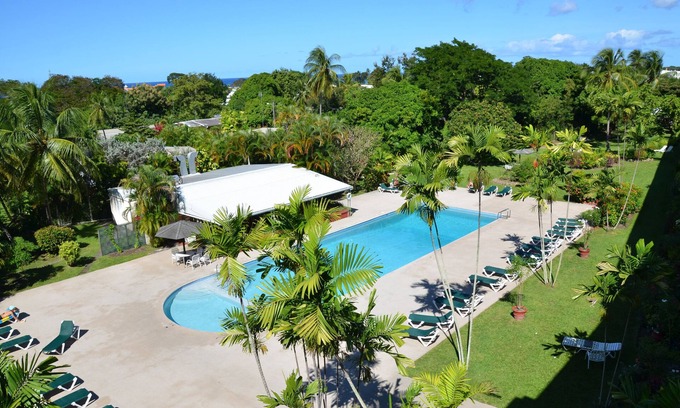 Halcyon Heights Apartment | Beautiful 4th.floor condo with pool and spectacular sunsets and ocean view