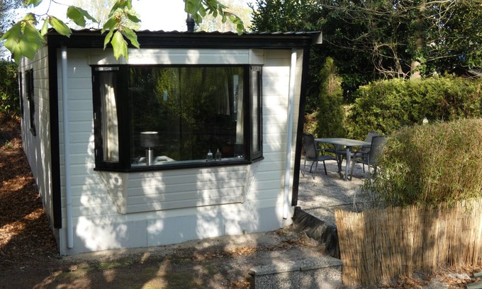 Marum Ski Chalet | Beautiful chalet for rent overlooking ornamental pond against forest + parking lot