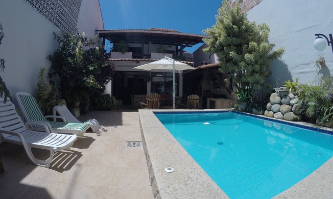 Taio House | Beautiful house with pool and 7 rooms in Arraial - are five suites.