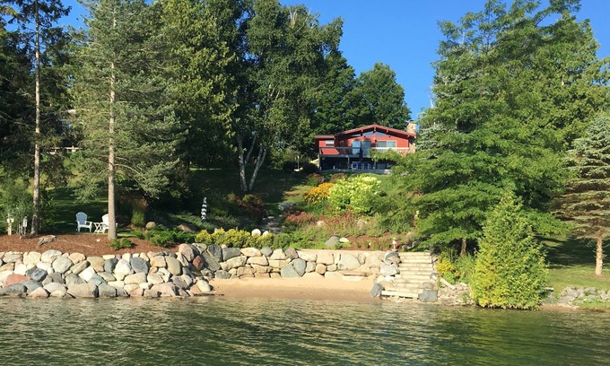 East Jordan House | Beautiful sloping view to water's edge on this Lake Charlevoix South Arm escape.