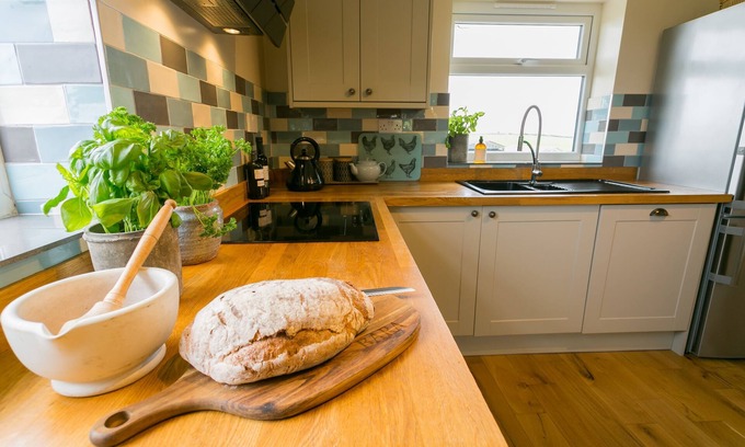 Cemaes Bay Cottage | Bettws Farmhouse - a ground floor bedroom that sleeps 8 guests in 4 bedrooms
