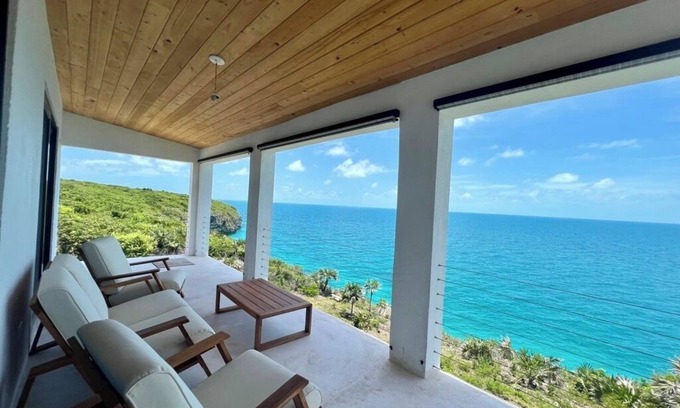 Gregory Town House | Big Pink:nmid-century modern 2bedroom oceanfront home on cliffs of Gregory Town