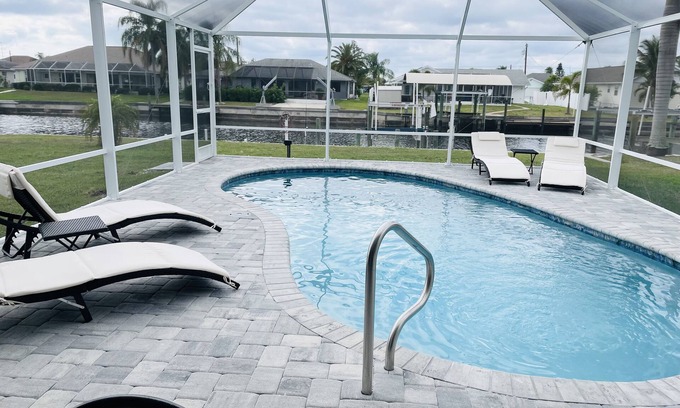 Gulf Cove House | Bright Waterfront Home. Heated Pool. Short drive to Beach. Beautiful Sunsets.