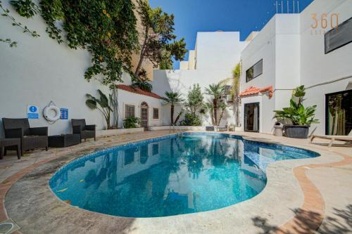 Tal-Ghoqod Villa | Bungalow home with Stunning Pool Area in St'Julians By 360 Estates