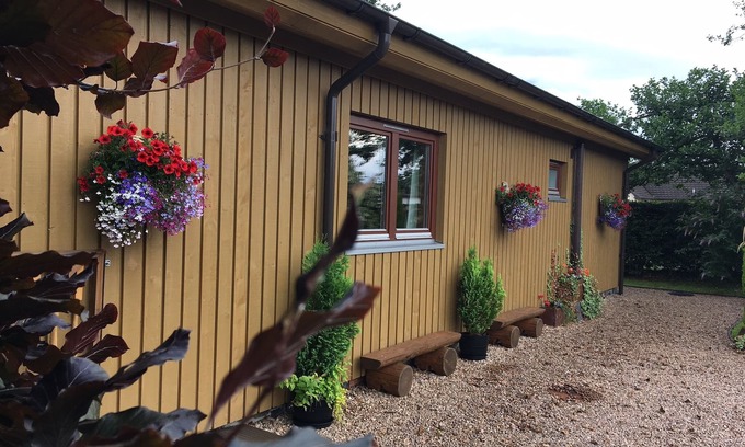 Banavie Ski Chalet | Burnside Lodge, overlooking river Lundy, backdrop of Ben Nevis and Nevis Range.