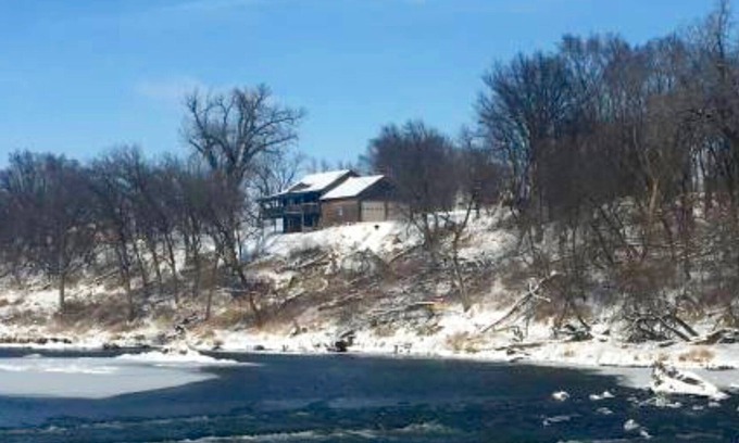 Larchwood House | Cabin on bluff of Big Sioux River with rushing waters of the Klondike Dam below.