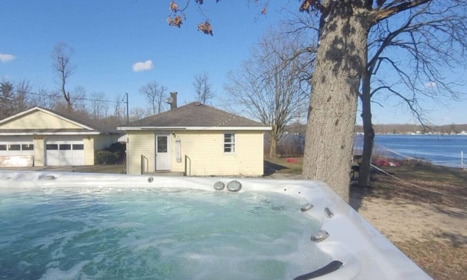 Alto House | Campau Lake Sunshine, hot swim spa tub, King Bed lakefront
