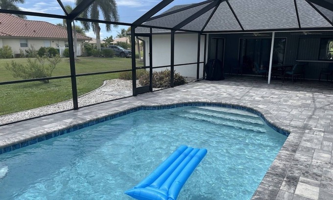 Pebble Beach House | Canal-front home with private pool, grill, patio, AC, W/D & gorgeous views